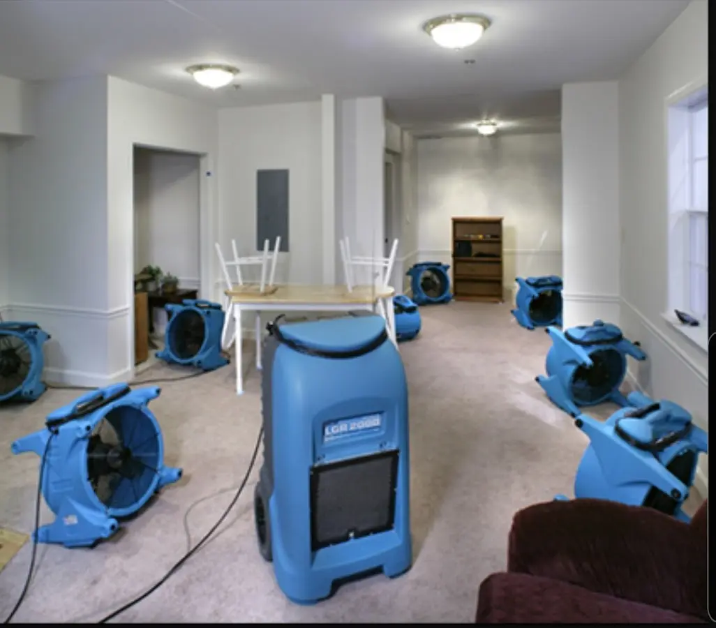 Air movers and dehumidifier setup for Water Damage Restoration in Grafton